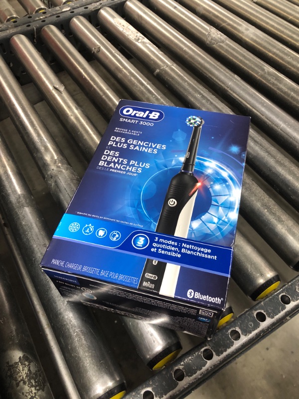 Photo 1 of Oral-B Genius X Limited Rechargeable Electric Toothbrush with 1 Replacement Brush Head, Travel Case, Midnight Black