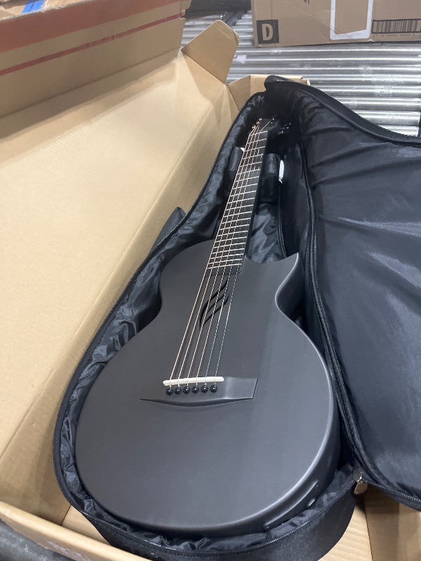 Photo 1 of Enya NOVA Go SP1 Carbon Fiber Acoustic Electric Guitar with Smart AcousticPlus 35 Inch Travel Acustica Guitarra Starter Bundle Kit of Gig Bag, Strap, Strings, Charging Cable, Instrument Cable(Black)