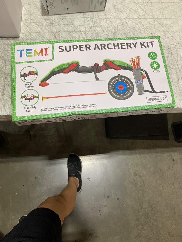 Photo 1 of TEMI Kids Bow and Arrow Set - LED Light Up Archery Toy Set with 10 Suction Cup Arrows, Target & Quiver, Indoor and Outdoor Toys for Children Boys Girls