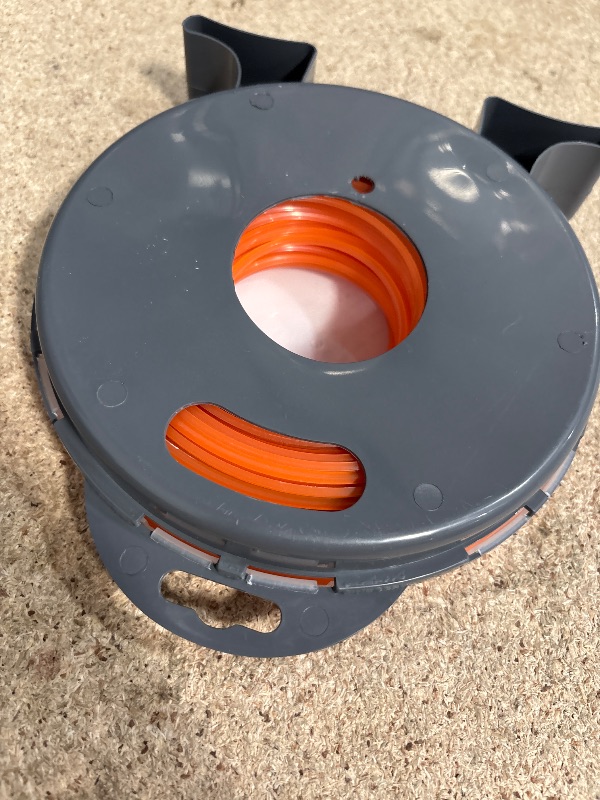 Photo 1 of A ANLEOLIFE 1-Pound Commercial Square .095-Inch-by-212-ft String Trimmer Line Donut,with Bonus Line Cutter, Orange