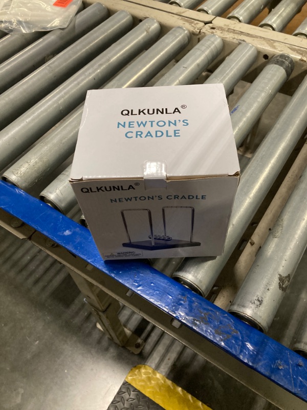 Photo 1 of   ***NEEDS TO BE RE STRINGED
QLKUNLA Newtons Cradle Balance Balls Science Physics Gadget Desktop Decoration Kinetic Motion Toy for Home and Office