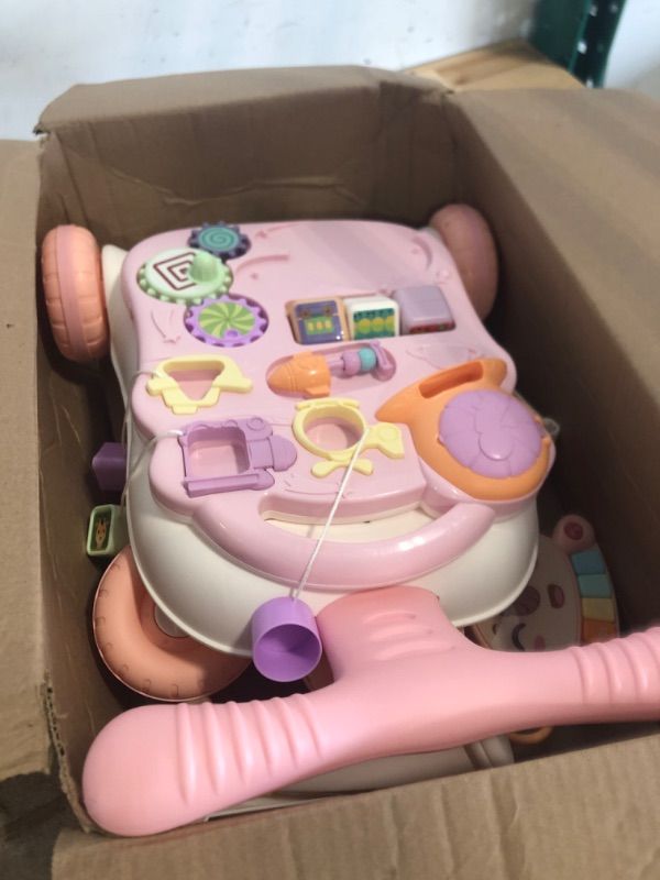 Photo 1 of TOY Life 3 in 1 Baby Push Walker and Activity Center for Girl, Sit to Stand Walker for Babies 6-12 Months, Walking Toys with Music Panel for Infants and Toddlers Learning to Walk Pink