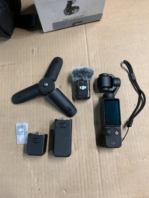 Photo 1 of DJI Osmo Pocket 3 Creator Combo, Vlogging Camera with 1'' CMOS, 4K/120fps Video, 3-Axis Stabilization, Face/Object Tracking, Fast Focusing, Mic Included for Clear Sound, Digital Camera for Photography
