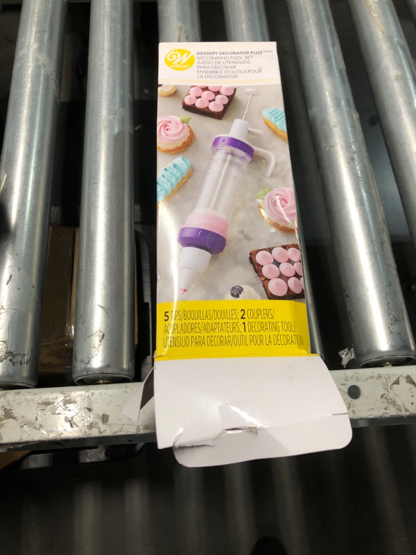 Photo 1 of **PREV USED, DIRTY, NEEDS TO BE CLEANED***
Wilton Dessert Decorator - The Kit Includes a Plunger-Style Tool, 2 Couplers, 1 Fill Tip, 4 Decorating Tips, Plastic, White & Purple