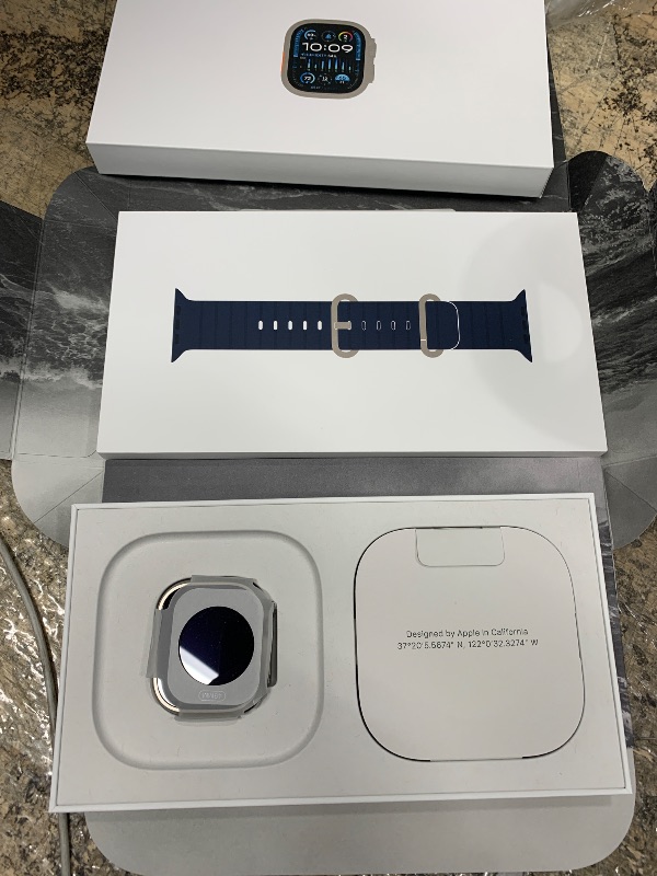 Photo 1 of *iCLOUD LOCKED* Apple Watch Ultra 2 [GPS + Cellular 49mm] Smartwatch with Rugged Titanium Case & Blue Ocean Band One Size. Fitness Tracker, Precision GPS, Action Button, Extra-Long Battery Life