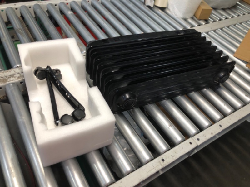 Photo 1 of ***DAMAGED - PRONG ON PLUG BROKEN - SEE PICTURES***
Amazon Basics Oil Heater, Radiator Heater for Indoor Use, With Over-Heat Protection, 7 Oil-Filled Steel Fins, 3 Heat Settings, ETL-certified Safety, 1500W, Black, 11"D x 14.8"W x 25.2"H