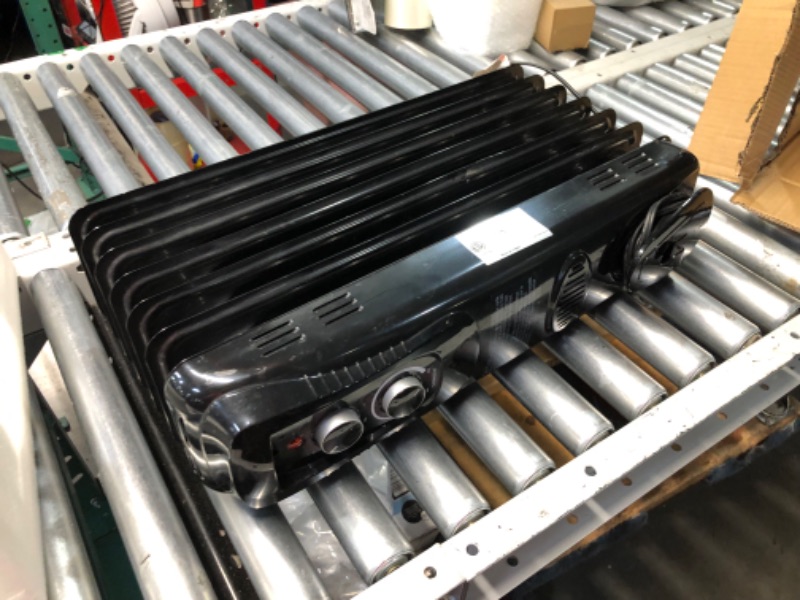 Photo 1 of ***DAMAGED - PRONG ON PLUG BROKEN - SEE PICTURES***
Amazon Basics Oil Heater, Radiator Heater for Indoor Use, With Over-Heat Protection, 7 Oil-Filled Steel Fins, 3 Heat Settings, ETL-certified Safety, 1500W, Black, 11"D x 14.8"W x 25.2"H