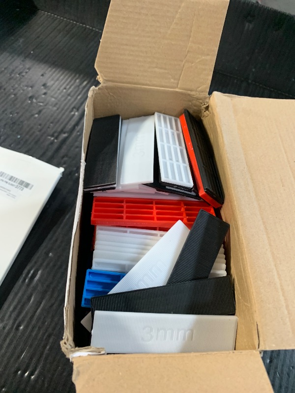 Photo 1 of Konohan 300 Pcs Plastic Flat Shims Structural Tile Plastic Shims for Leveling, 3/64, 5/64, 1/8, 5/32, 3/16, 1/4, Green, Black, White, Grey, Blue, Red
