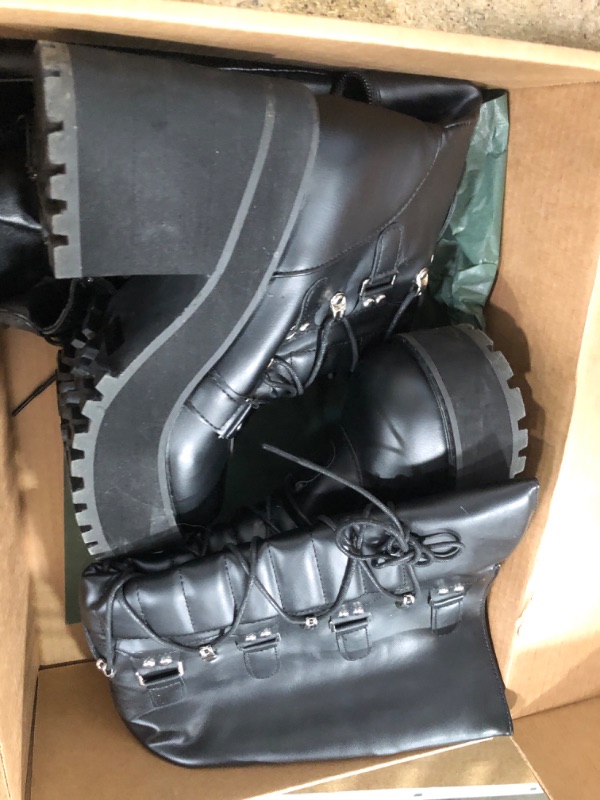 Photo 1 of (HAS A BIG INDENT IN THE FRONT) SIZE 6.5 BOOTS WOMENS