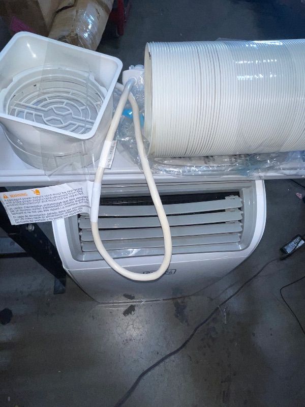 Photo 1 of ***ITEM TESTED FOR POWER, UNABLE TO TEST FURTHER***
BLACK+DECKER Smart Portable Air Conditioner, 14,000 BTU (10,200 BTU SACC) for Rooms up to 700 Sq. Ft., Smart Portable AC with Follow Me Remote and Window Kit, BPACT14WT, White