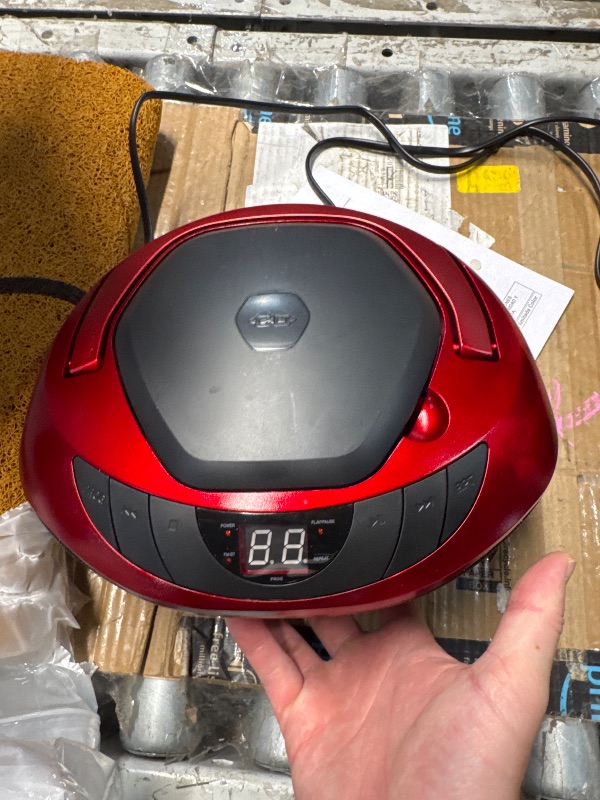 Photo 1 of (POWER TESTED) (USED/FAIR) Jensen CD-475R Portable Sport Stereo Boombox CD Player with AM/FM Radio and Aux Line-in & Headphone Jack (Red)