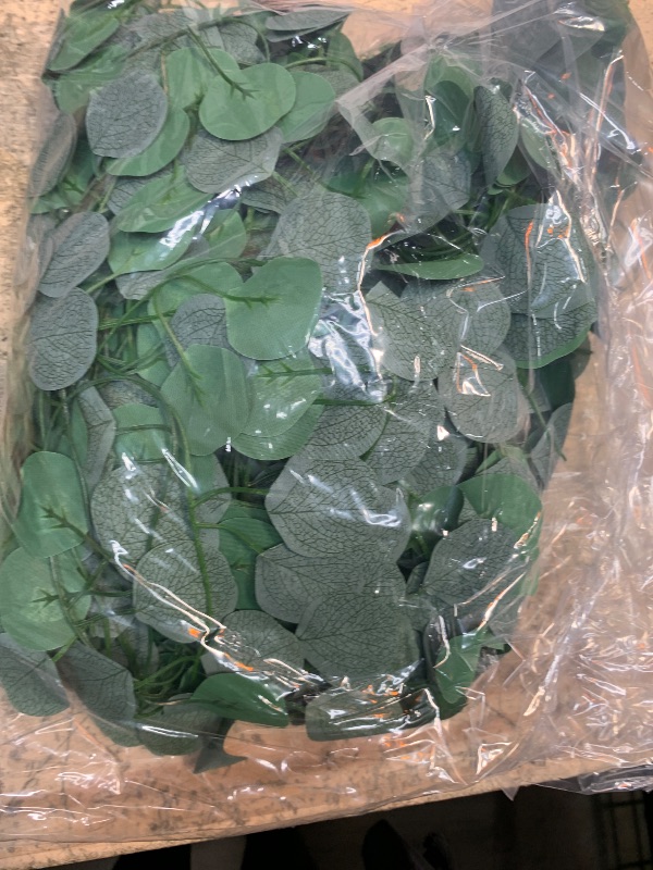 Photo 1 of CQURE 12 Pack Eucalyptus Garland,Artificial Eucalyptus Leaves Table Greenery Garland Wreath Vines for Wedding Party Table Fireplace Bedroom Wall Room Decor