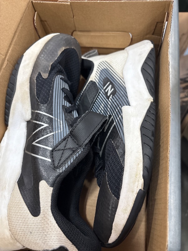 Photo 1 of **** HEAVY USE***** New Balance Kid's Rave Run V2 Lace-up Sneaker, Black/White, 5 Wide Big Kid