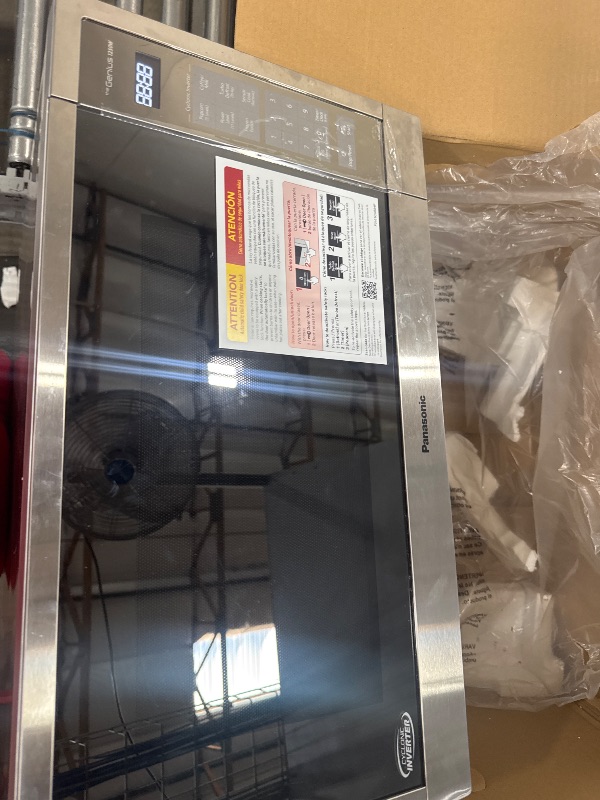 Photo 1 of -POWERS ON**Panasonic - 2.2 Cu. Ft. 1250 Watt SN97JS Microwave with Cyclonic Inverter and Sensor Cooking - Stainless steel