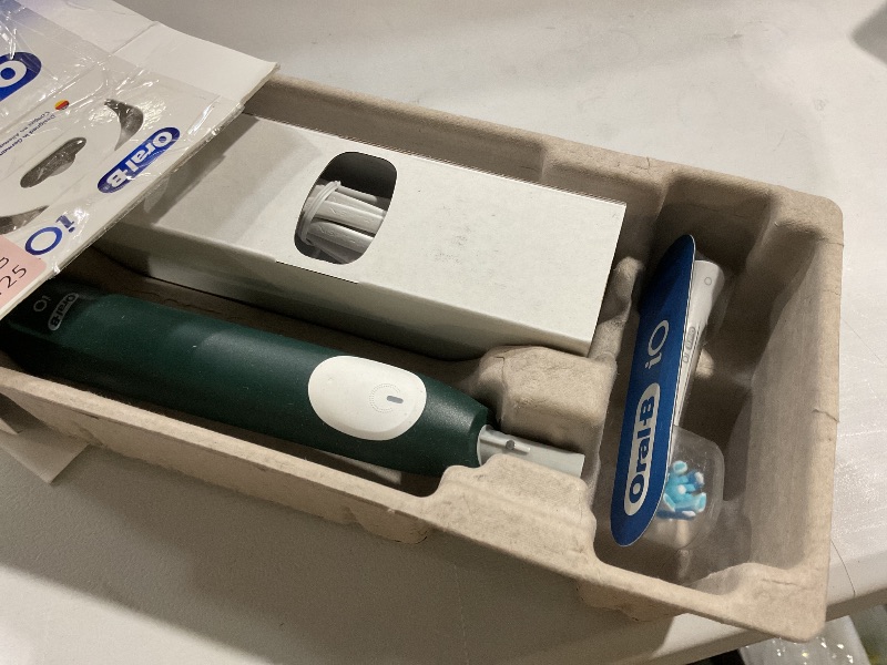 Photo 1 of **** SEE COMMENTS**** *ONLY ONE BRUSH HEAD* Oral-B iO Series 2 Rechargeable Electric Powered Toothbrush Starter Kit, Forest Green with 1 Brush Head - Automatic Pressure Sensor to Protect Gums - 3 Modes - 2 Min Timer