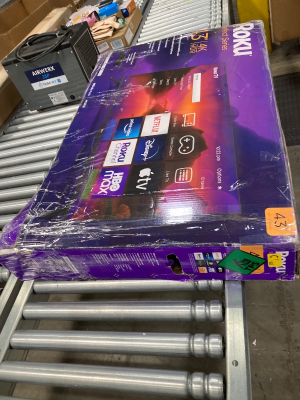 Photo 1 of ***MISSING LEG STAND***SELLING AS IS ****Roku Smart TV – 43-Inch Select Series 4K HDR RokuTV with Roku Enhanced Voice Remote, Brilliant 4K Picture, Automatic Brightness, & Seamless Streaming – Live Local News, Sports, Family Entertainment   ***(BOX RIPPED