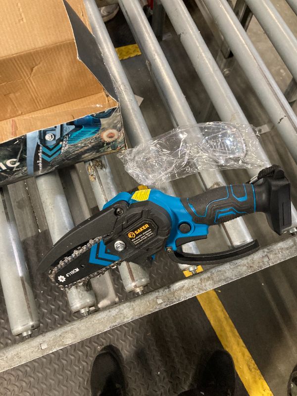 Photo 1 of ***sell for parts only, missing battery and charger, no tools, only safety glass and chainsaw*** Saker Mini Chainsaw,Portable Electric Chainsaw Cordless,Handheld Chain Saw Pruning Shears Chainsaw for Tree Branches,Courtyard,Household and Garden Gifts for 