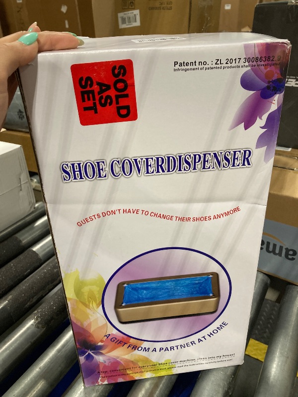 Photo 1 of Blemoacha Automatic Shoe Covers Dispenser,200 Pcs Disposable Shoe Cover,Waterproof T Buckle Shoes Cover for Adult and Kids All Sizes,Portable Machine for Indoors/Home/Office/Hospital (Gold)