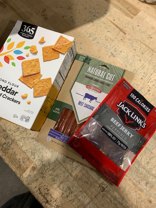 Photo 1 of 365 by Whole Foods Market Cheddar Almond Flour Crackers EXP: 4/26/25, Jack Link's Original Beef Jerky - 2.6oz EXP: 6/15/25, AND Old Wisconsin Natural Cut Hardwood-Smoked Beef Snack Sticks 6 Oz EXP: 4/27/25
