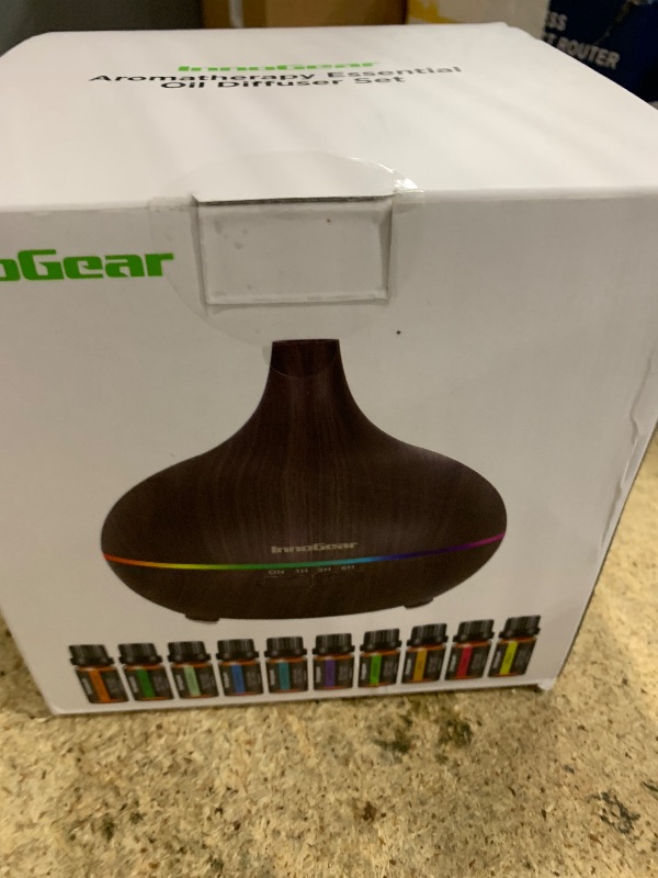 Photo 1 of InnoGear Aromatherapy Diffuser & 10 Essential Oils Set, 400ml Diffuser Ultrasonic Diffuser Cool Mist Humidifier with 4 Timers 7 Colors Light Waterless Auto Off for Large Room Office, Dark Wood Grain
