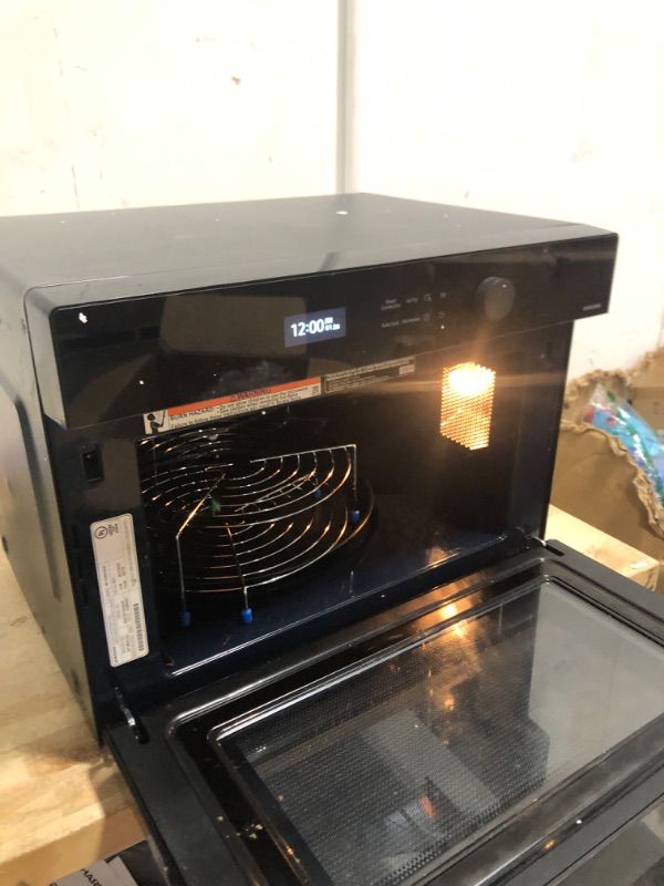 Photo 1 of 1.2 cu. ft. Countertop Microwave with Power Convection in Black Glass
