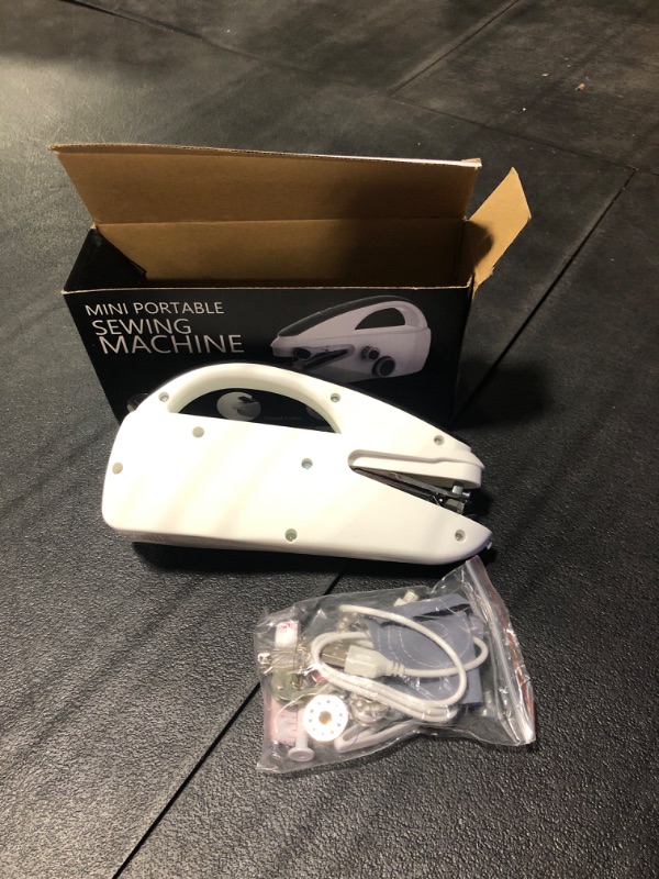 Photo 1 of Handheld Sewing Machine,Two dear,Mini sewing machine,Easy to Use and Fast Stitch Suitable for Clothes,Fabrics, DIY Home Travel Electric Handheld Sewing Machine for Beginners(RED).