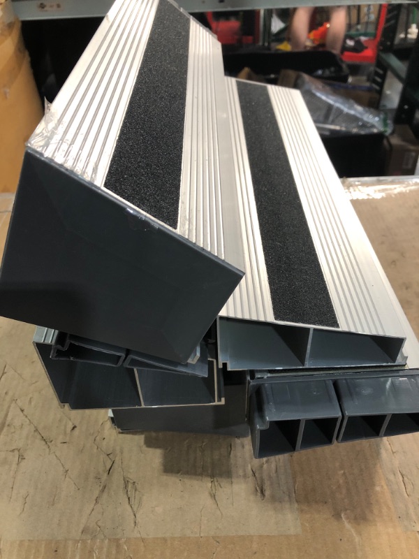 Photo 1 of (used)(unknown if complete) Nuvium 4" Rise Modular Threshold Ramp for Doorways, Stable Wheelchair Ramp for Home Steps, Aluminum Door Ramp and Curb Ramp 