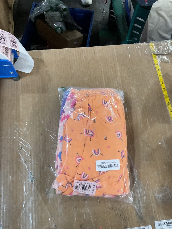 Photo 1 of Amazon Essentials Girls' Knitted Ruffle Scooter Skirts (Previously Spotted Zebra), Pack of 3, Purple/Light Pink/Orange, Medium