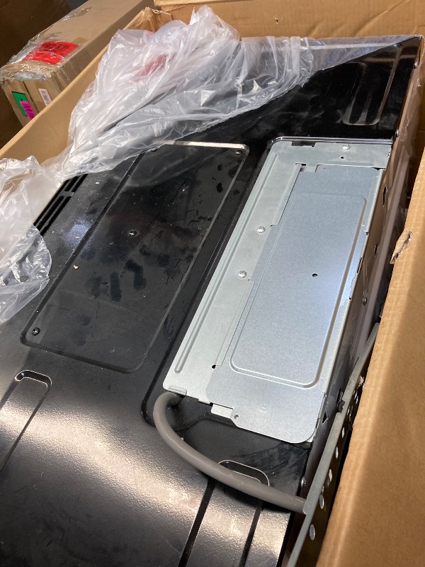 Photo 1 of *****ITEM IS BADLY USED AND DIRTY ****PARTS ONLY***BLACK+DECKER Over the Range Microwave Oven with Vent and One-Touch Auto Cooking, 1.7 cu. ft. OTR Over Stove Microwave, Stainless Steel, 1000 Watts, EM044K6CE-SS