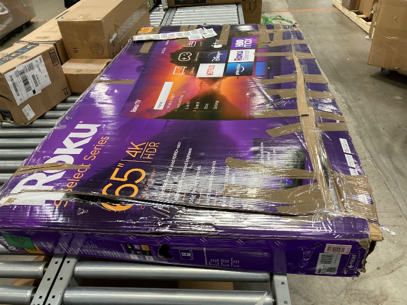 Photo 1 of **CRACKED SCREEN, PARTS ONLY** Roku Smart TV – 65-Inch Select Series 4K HDR RokuTV with Roku Enhanced Voice Remote, Brilliant 4K Picture, Automatic Brightness, & Seamless Streaming – Live Local News, Sports, Family Entertainment