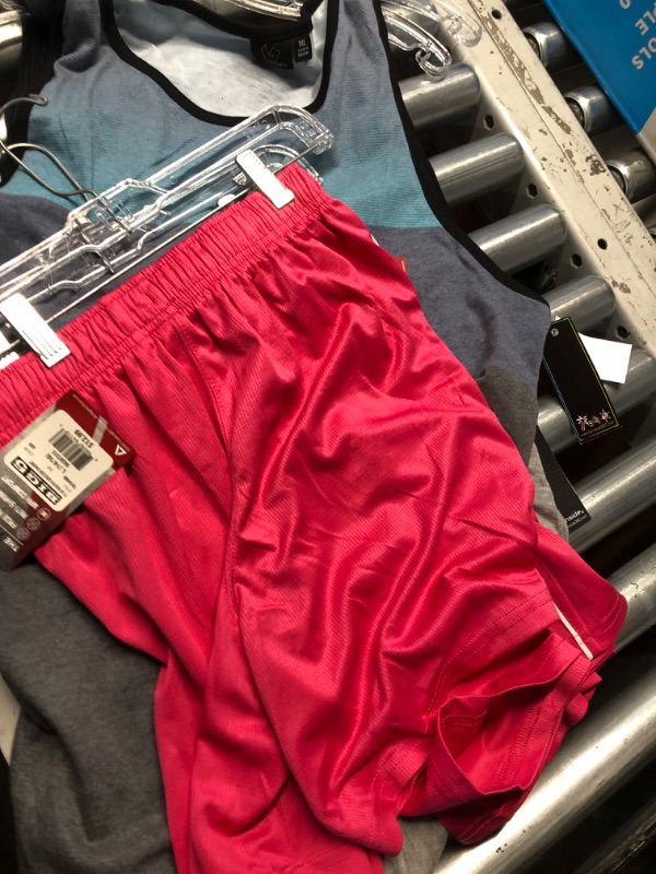 Photo 1 of Assorted box of clothing, different sizes, male and female clothing, pants, shorts, shirts, and swimsuits. Activewear
