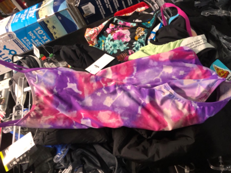 Photo 1 of Assorted box of clothing, different sizes, male and female clothing, pants, shorts, shirts, and swimsuits. Activewear