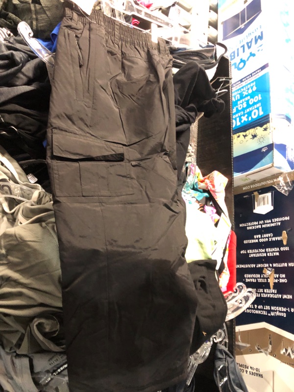 Photo 1 of Assorted box of clothing, different sizes, male and female clothing, pants, shorts, shirts, and swimsuits. Activewear