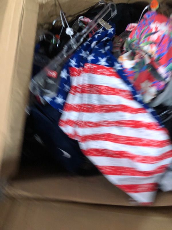 Photo 1 of Assorted box of clothing, different sizes, male and female clothing, pants, shorts, shirts, and swimsuits. Activewear