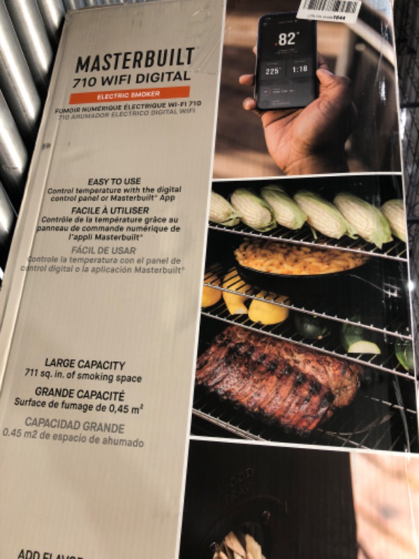 Photo 1 of Masterbuilt®710 WiFi Digital Smoker, Vertical Design, 711 Cooking Sq. Inches, 4 Chrome Coated Smoking Racks, Wood Chip Loader, Electric Fuel Source to Plug in and Start Cooking, Black Model MB20070924