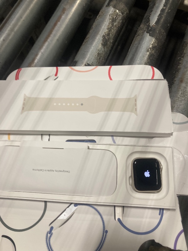 Photo 1 of **LOCKED**Apple Watch SE (2nd Gen) [GPS 40mm] Smartwatch with Starlight Aluminum Case with Starlight Sport Band S/M. Fitness and Sleep Trackers, Crash Detection, Heart Rate Monitor, Retina Display