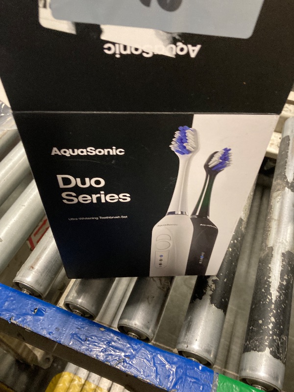 Photo 1 of **new but open**Aquasonic Duo - Dual Handle Ultra Whitening 40,000 VPM Wireless Charging Electric ToothBrushes - 3 Modes with Smart Timers - 10 Dupont Brush Heads & 2 Travel Cases Included