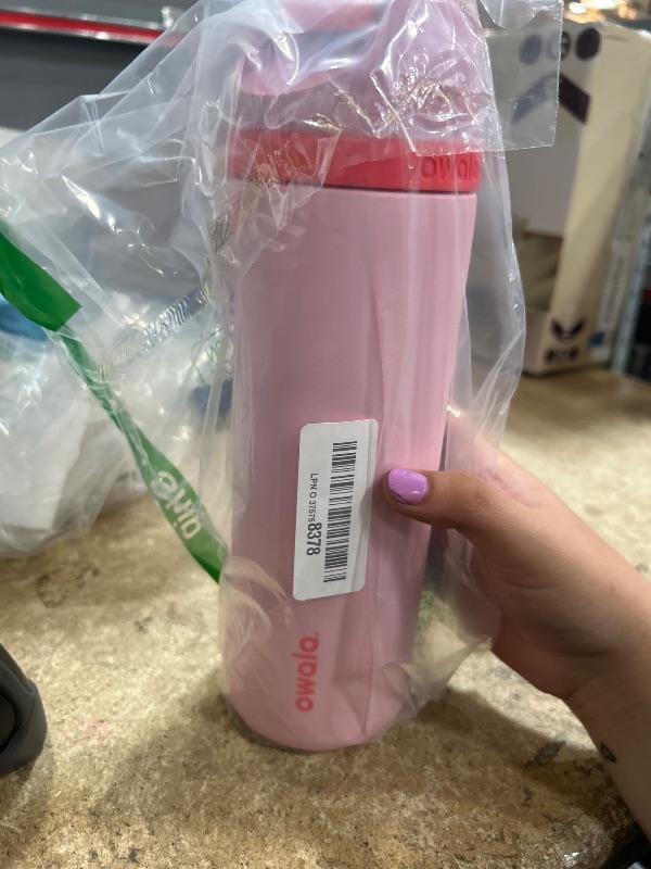 Photo 1 of Owala FreeSip Insulated Stainless Steel Water Bottle with Straw for Sports and Travel, BPA-Free Sports Water Bottle, 24 oz, Pink, Angel Food Cake