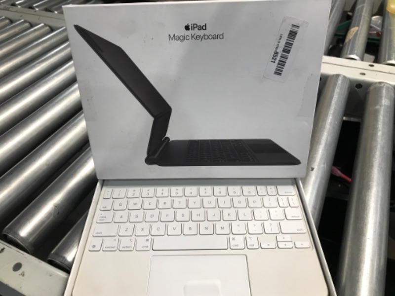 Photo 1 of **STOCK PHOTO, ITEM IS WHITE**
Apple Magic Keyboard: iPad Keyboard case for iPad Pro 11-inch (1st, 2nd, 3rd, 4th gen) and iPad Air (4th, 5th gen, and M2), Great Typing Experience, Built-in trackpad, US English - White
