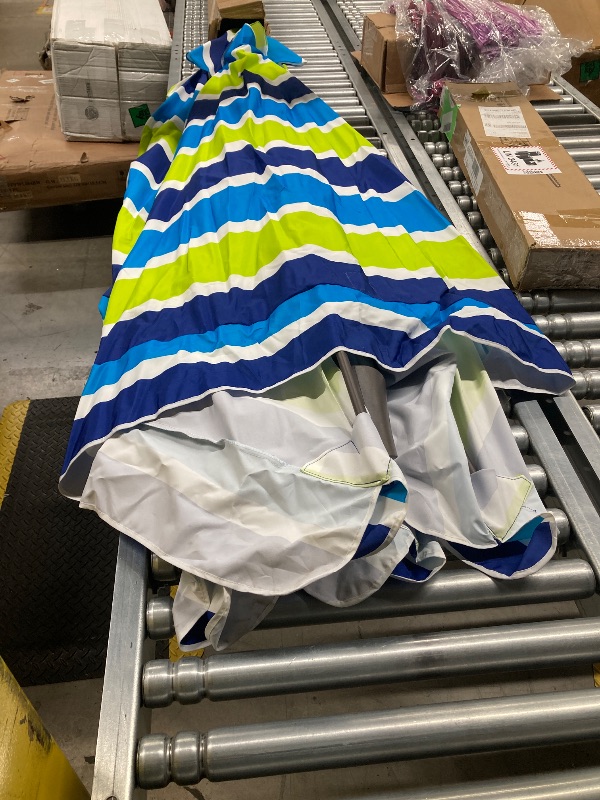Photo 1 of SIMILAR TO JEAREY 8x10 ft Rectangular Patio Umbrellas Outdoor Table Market Umbrella w/Crank, 8 Sturdy Ribs, UV Protection Waterproof Sunproof(Blue Green Striped)  ***(SOME SMALL DIRT SPOTS, SMALL RUST AREA ON POLOE, BOX RIPPED/TORN...SEE ALL PHOTOS)***