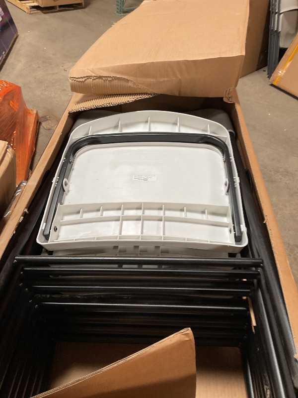 Photo 1 of Amazon Basics Folding Plastic Chair