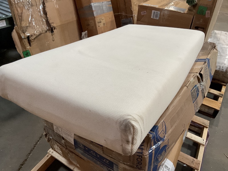 Photo 1 of **DIRTY FROM TRANSPORT **Naturepedic Organic Crib Mattress - 2-Stage 252 Coil Infant & Toddler Mattress with Protector Pad - Waterproof, Breathable & Non-Toxic Mattress for Baby and Toddler Bed