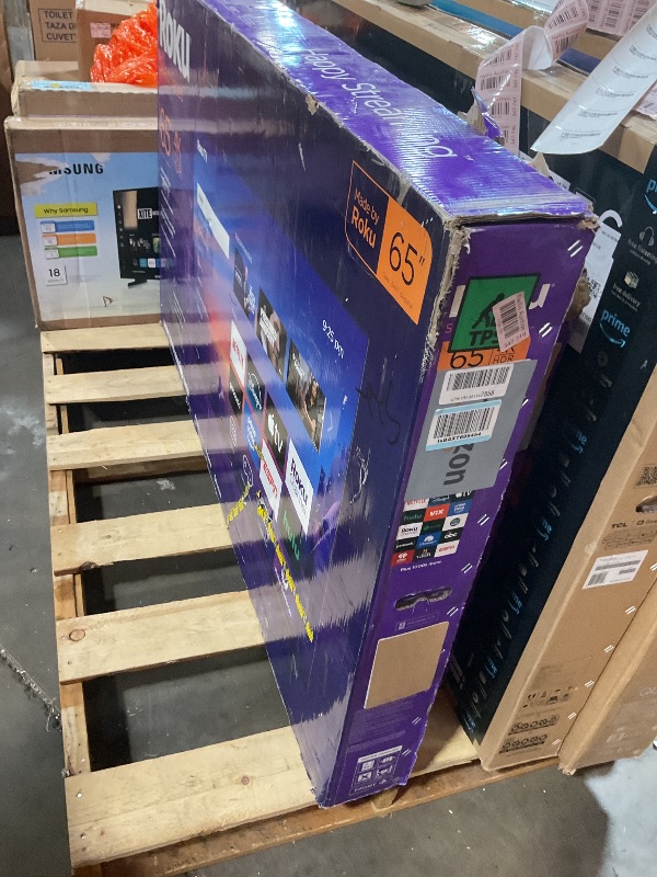 Photo 1 of **SELLING FOR PARTS. MAJOR DAMAGE TO SCREEN **Roku Smart TV 2025 – 65-Inch Select Series, 4K HDR TV – RokuTV with Enhanced Voice Remote – Flat Screen LED Television with Wi-Fi for Streaming Live Local News, Sports, Family Entertainment