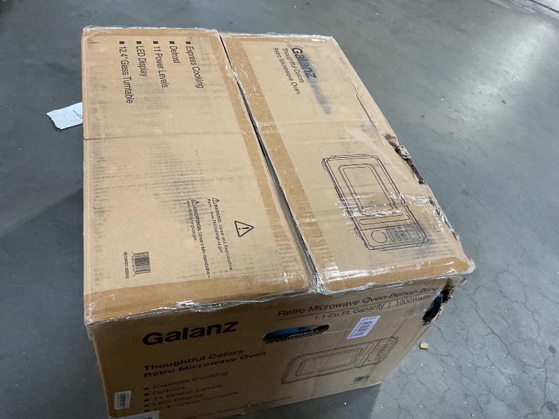 Photo 1 of **CORNER DENTED**Galanz GLCMKZ11BER10 Retro Countertop Microwave Oven with Auto Cook & Reheat, Defrost, Quick Start Functions, Easy Clean with Glass Turntable, Pull Handle, 1.1 cu ft, Blue