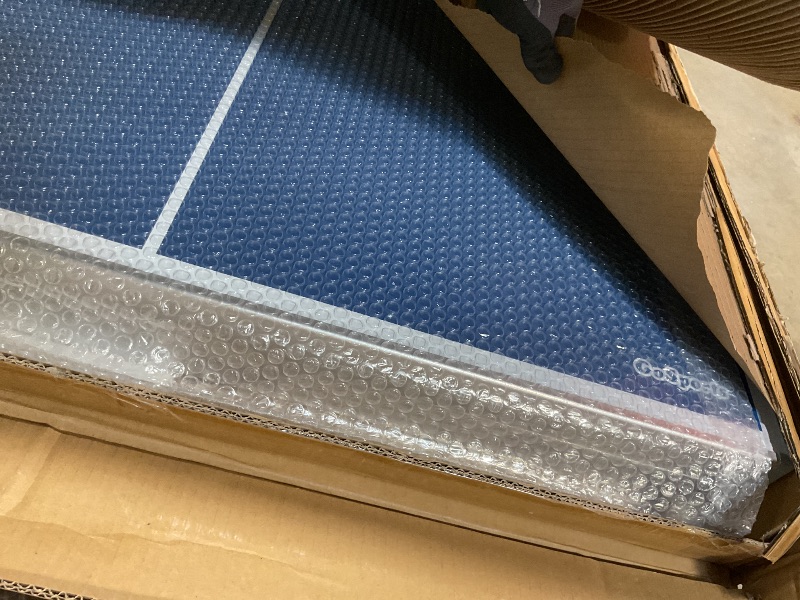 Photo 1 of **DAMAGES TO TABLE TOP** GoSports 6 ft x 3 ft Mid-Size Table Tennis Game Set - Indoor/Outdoor Portable Table Tennis Game with Net, 2 Table Tennis Paddles and 4 Balls