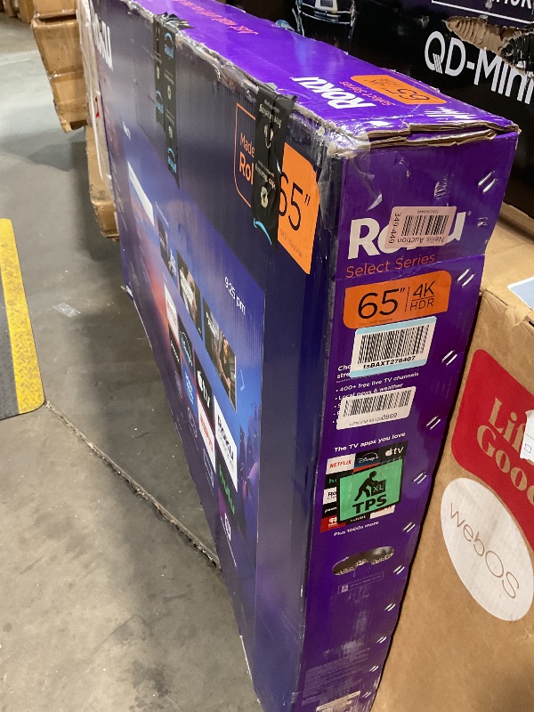 Photo 1 of **SELLING FOR PARTS AS PARTIAL SET L HEAVY DAMAGED CORNER OF SCREEN. Roku Smart TV 2025 – 65-Inch Select Series, 4K HDR TV – RokuTV with Enhanced Voice Remote – Flat Screen LED Television with Wi-Fi for Streaming Live Local News, Sports, Family Entertainm