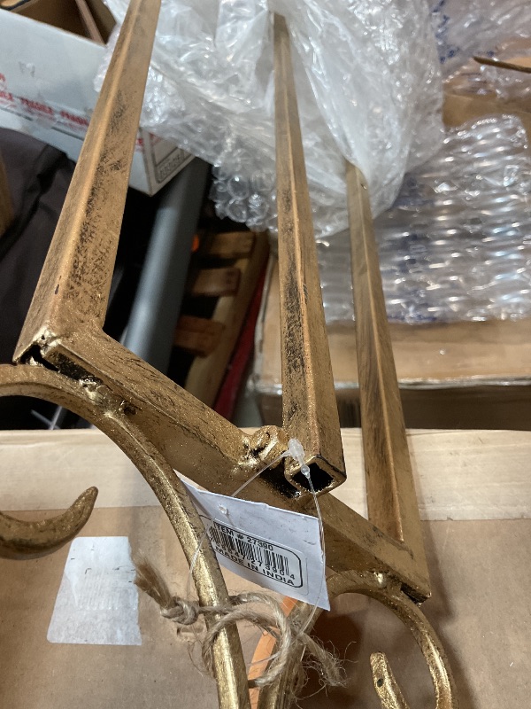 Photo 1 of **BAD PAINT JOB**Deco 79 Metal Scroll Display Easel Extra Large Adjustable 3 Tier Floor Standing Easel with Chain Support, Display Stand 23" x 33" x 68", Gold