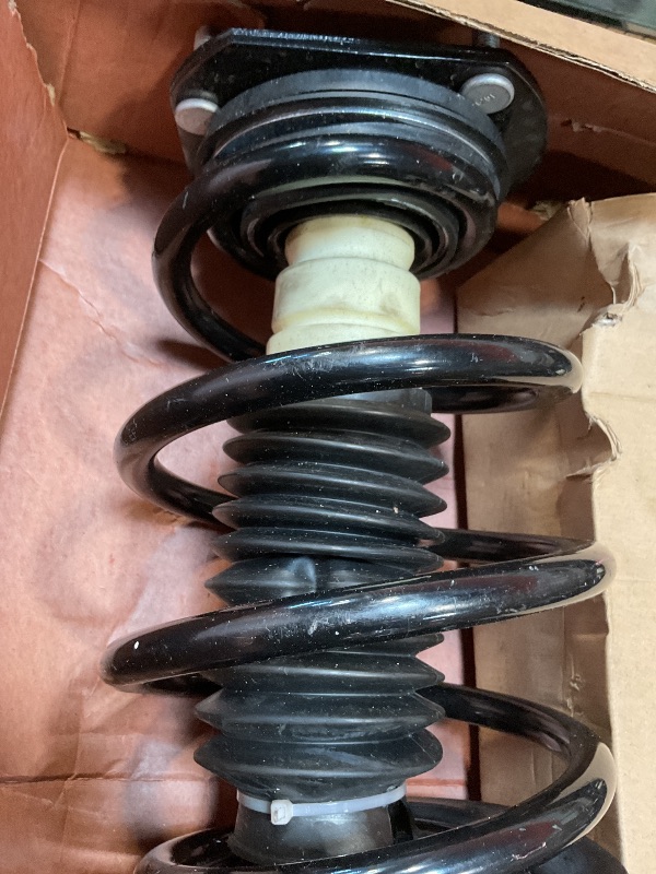 Photo 1 of **MINOR USE WEAR**Shock and strut assembly. Part number 041-312550. For year and make unknown