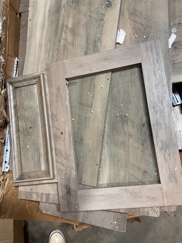 Photo 1 of *** POSSIBLY FOR PARTS/UNKNOWN DAMAGES/MISSING PIECES*** Storage cabinet with drawers. Features glass. No instructions found.