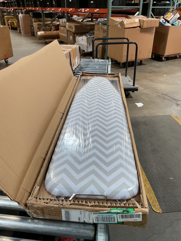 Photo 1 of Amazon Basics Full-Size Ironing Board - 4-Leg Fold-Up, Chevron Removable Cover, 60"L x 14"W x 38"H